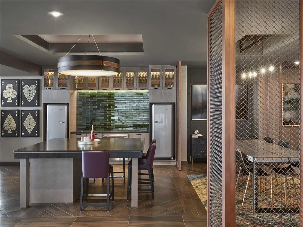 a kitchen with a table and chairs