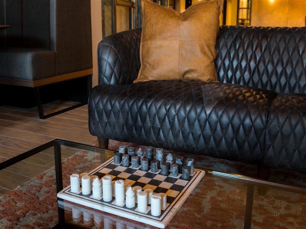 a chess board in a living room with a couch