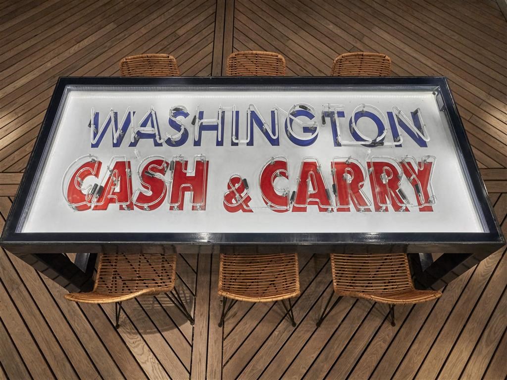 a sign cash and carry on a table