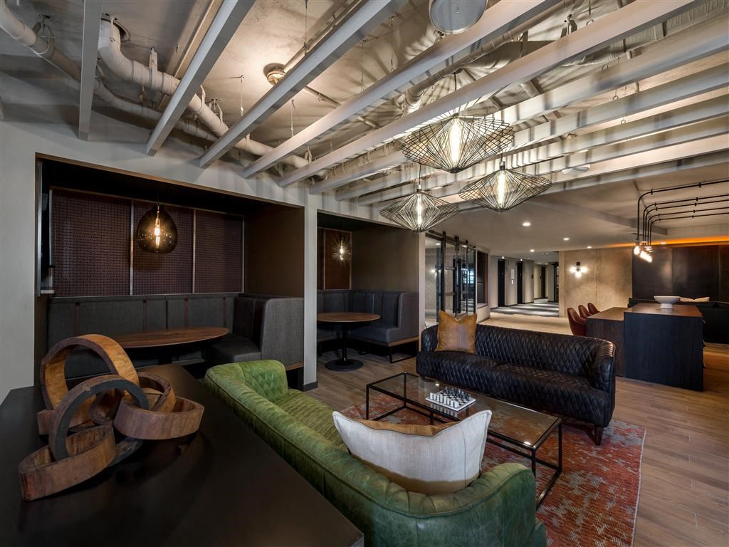 a lounge area with couches and chairs