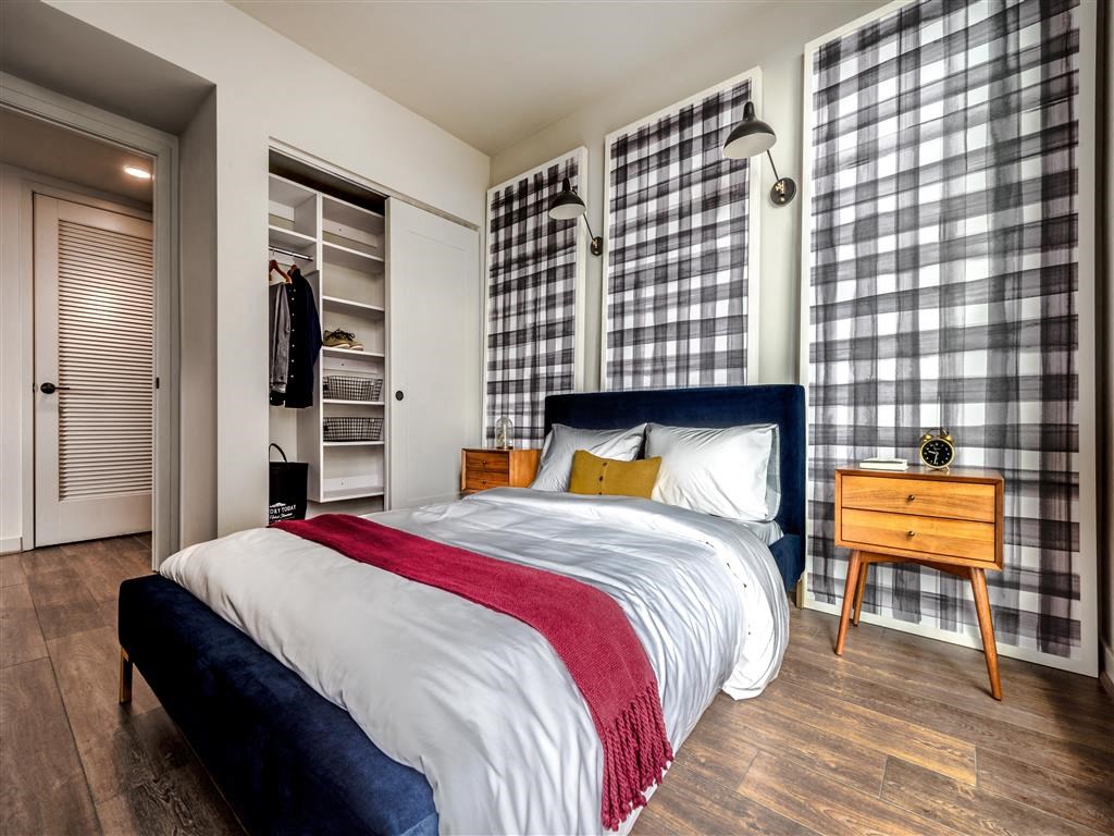 a bedroom with a bed and a closet