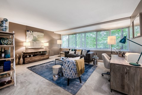 a living room with furniture and a large window