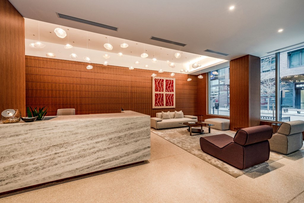the lobby of a hotel with a reception desk