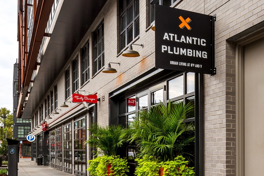 the facade of atlantic plumbing on a city street