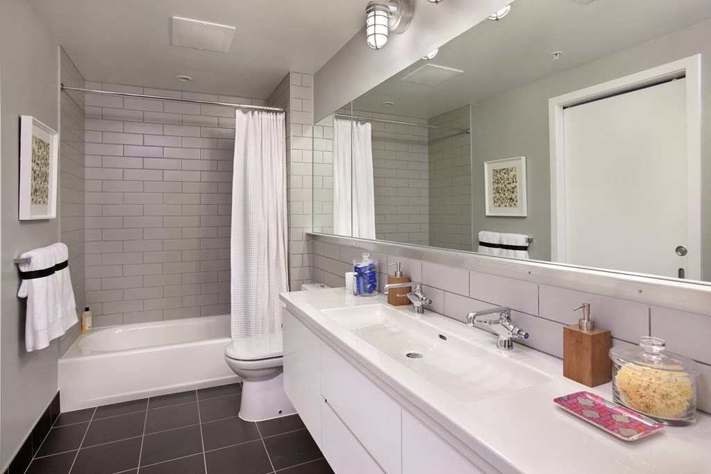 a bathroom with a sink and a toilet and a tub