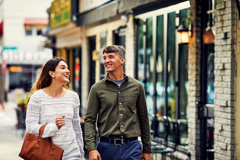 a man and a woman walking down a street