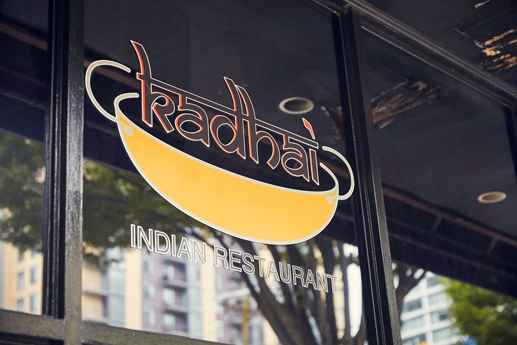 the logo is shown on the side of a restaurant window