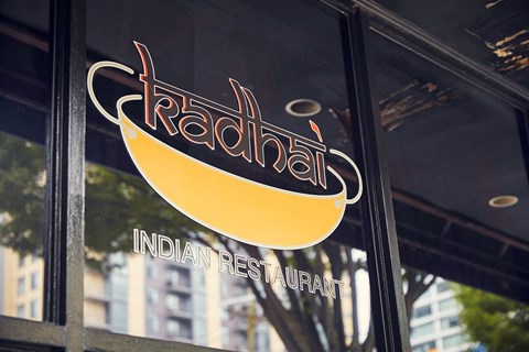 the logo is shown on the side of a restaurant window