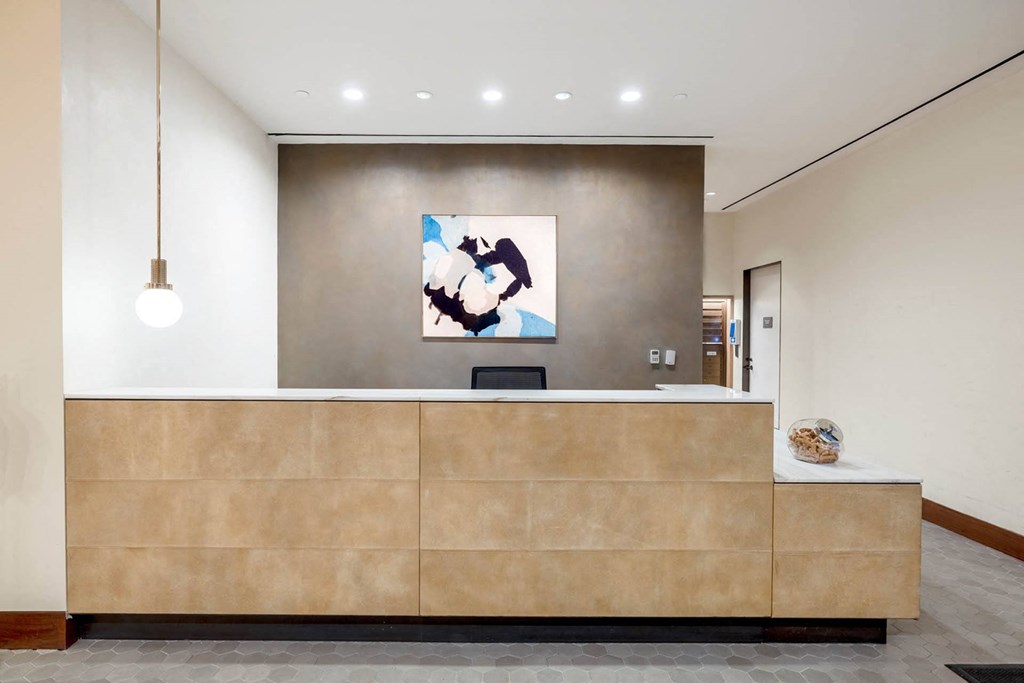 the lobby or reception area of a hotel with a reception desk