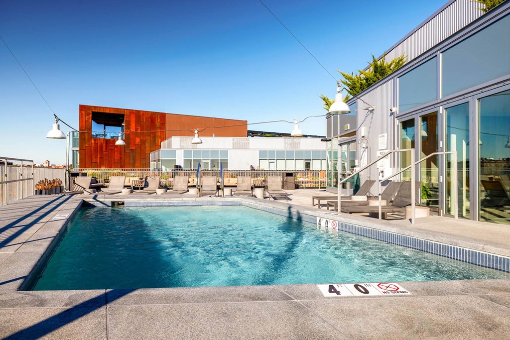 a swimming pool with a building in the background