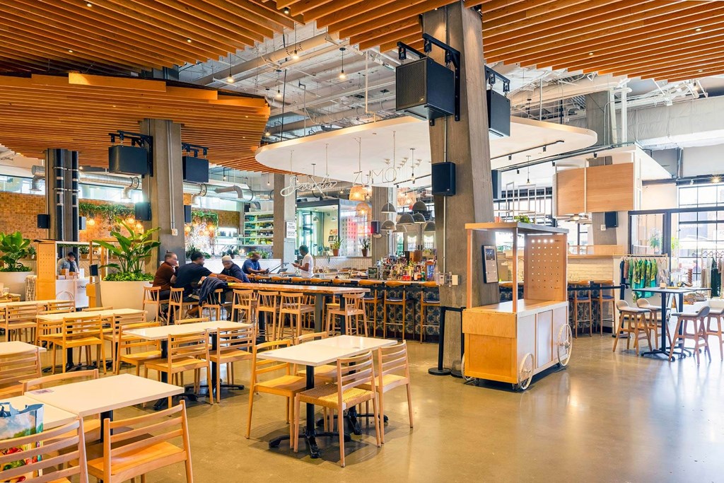 a restaurant with wooden tables and chairs