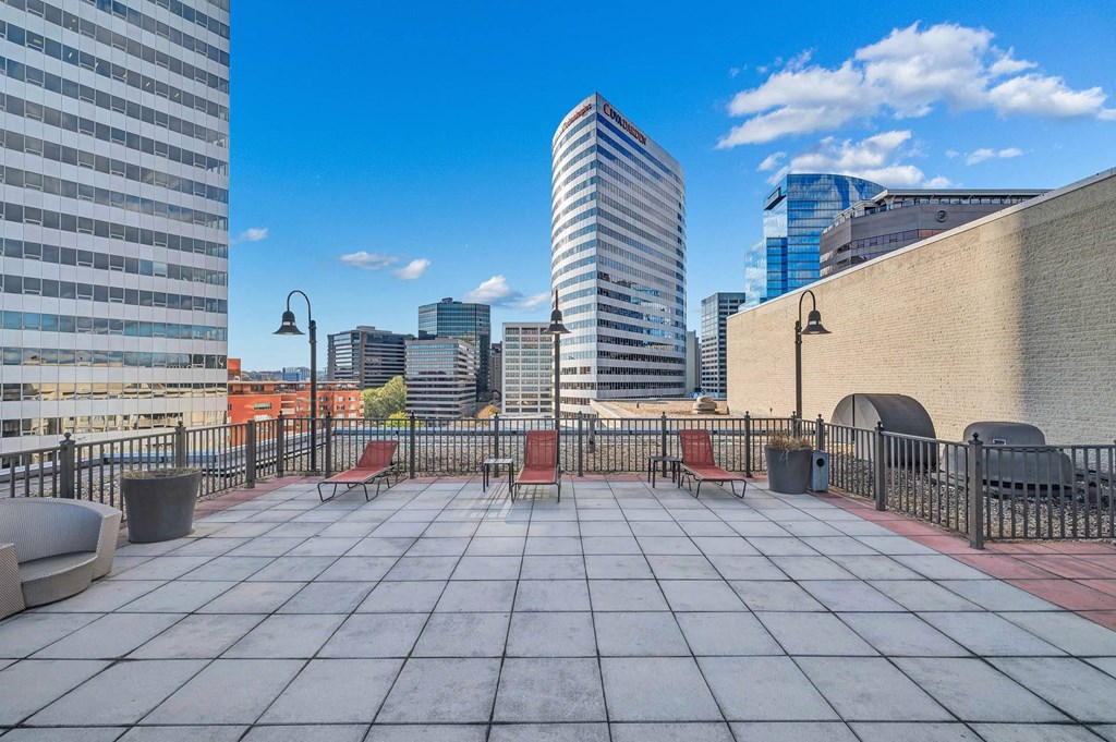 views of the city from the roof top patio of an apartment building