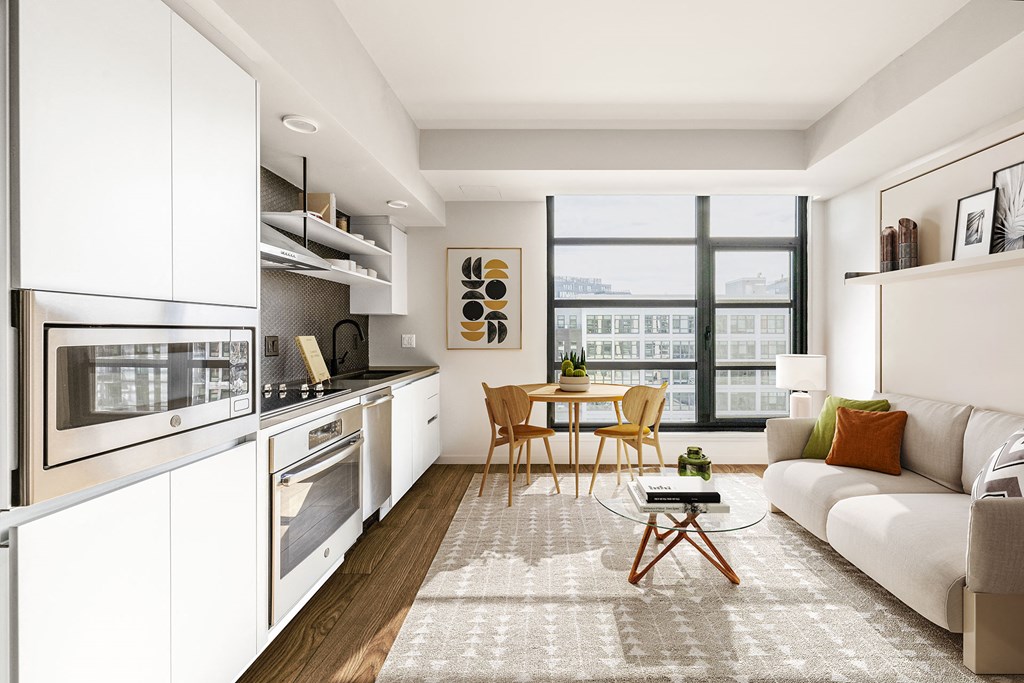 a kitchen and living room in a 555 waverly unit