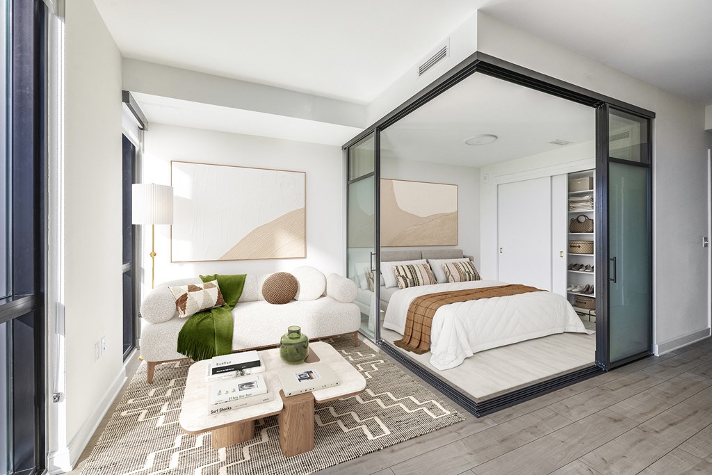 a bedroom with a large bed and a large window