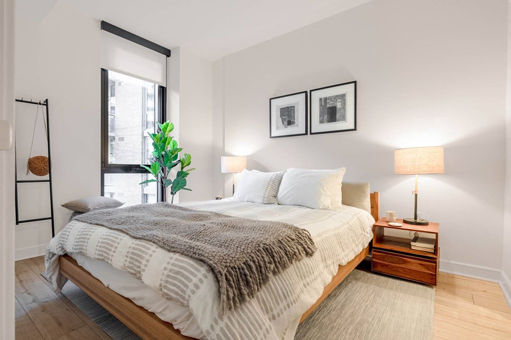 a bedroom with a large bed and a window