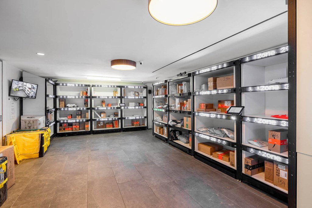 a room with shelves filled with boxes and other items