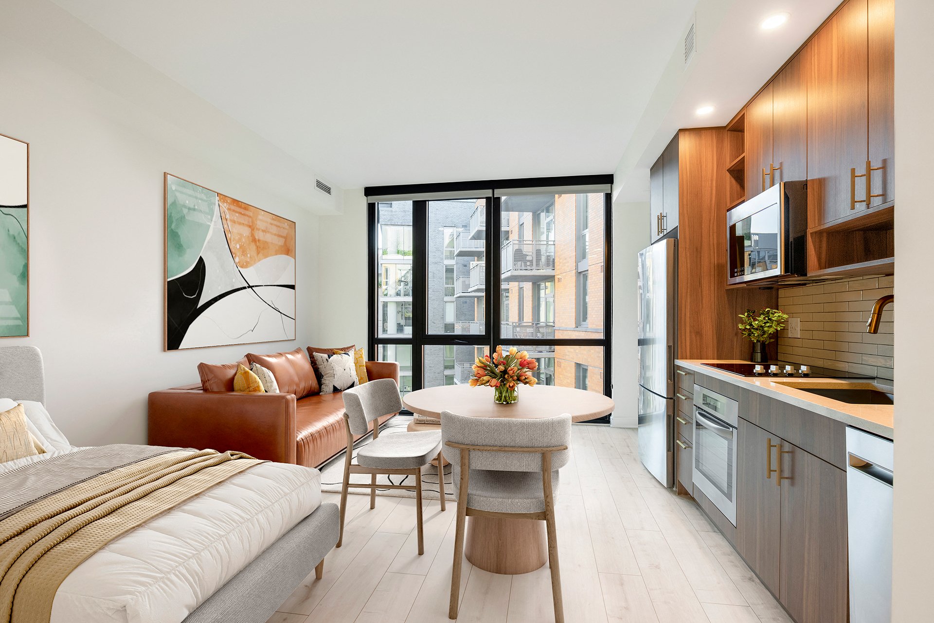 a bedroom with a bed and a table in a room