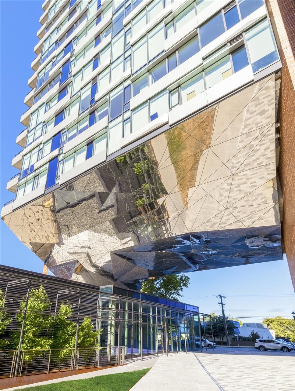 a reflection of a building on the side of a skyscraper
