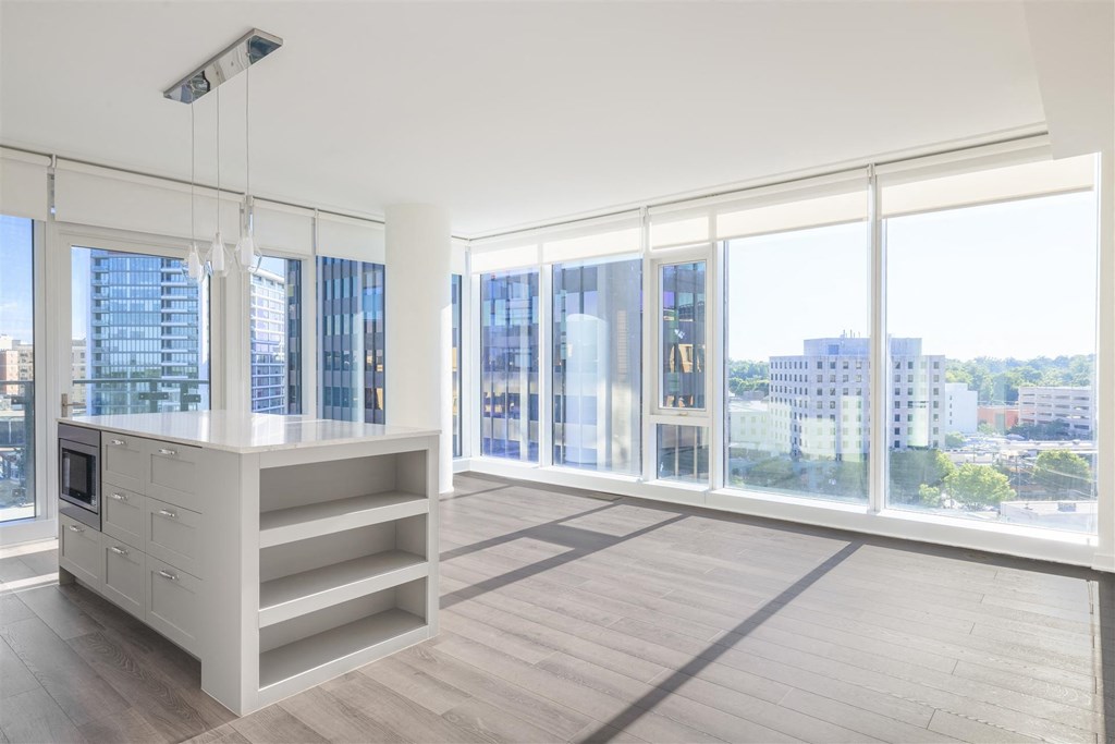 a living room with a city view and a large window