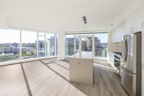 a kitchen with stainless steel appliances and a large window