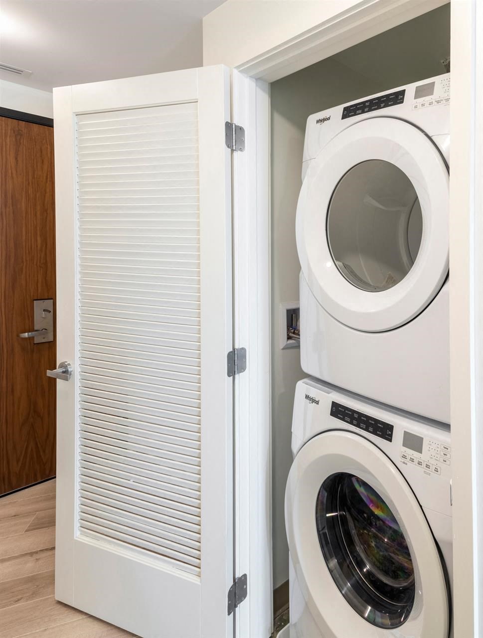 a white washer and dryer in a laundry room