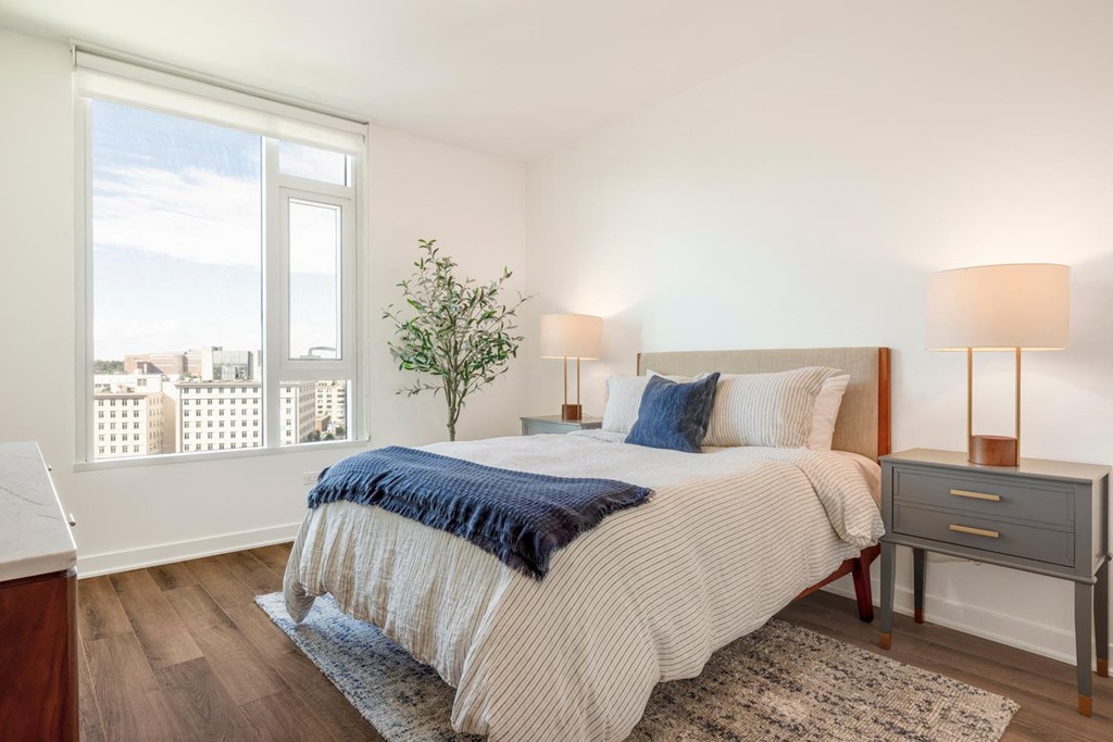 a bedroom with a bed and a window