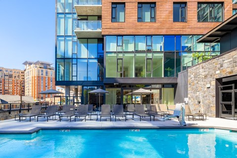 a swimming pool in front of a building