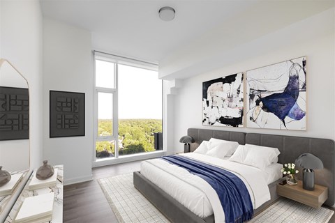 a bedroom with a large bed and a window