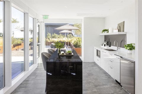 a kitchen with a large black island in the middle