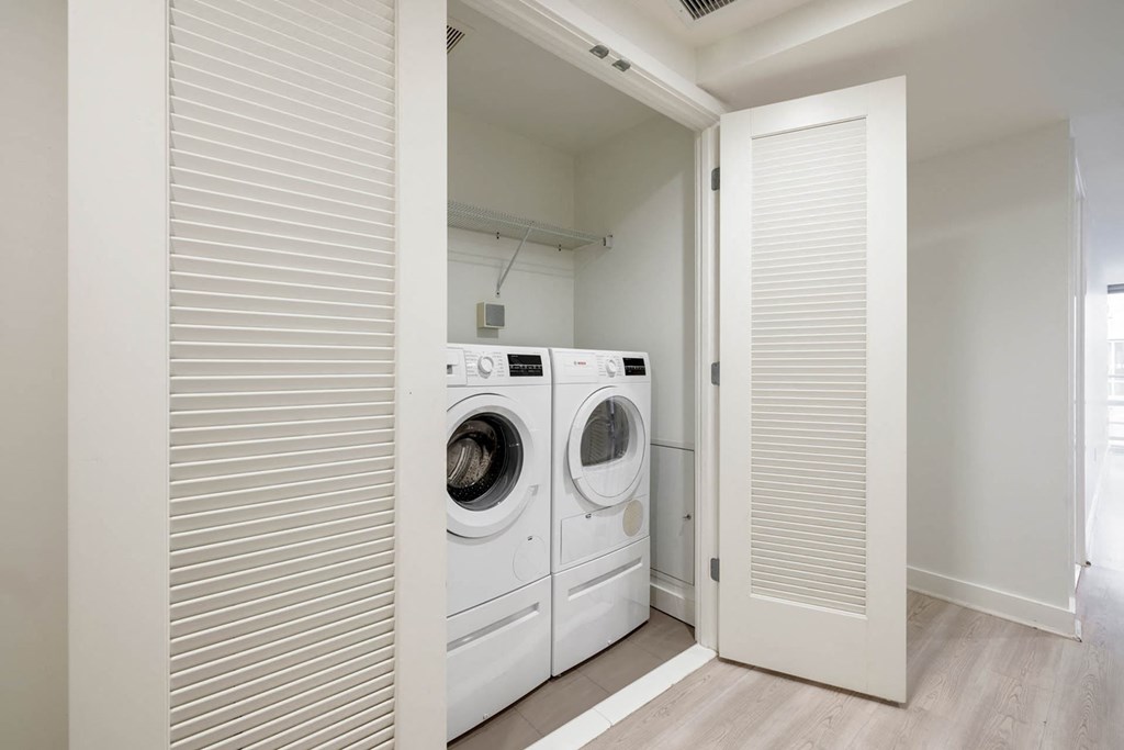 a washer and dryer in a laundry room with a door
