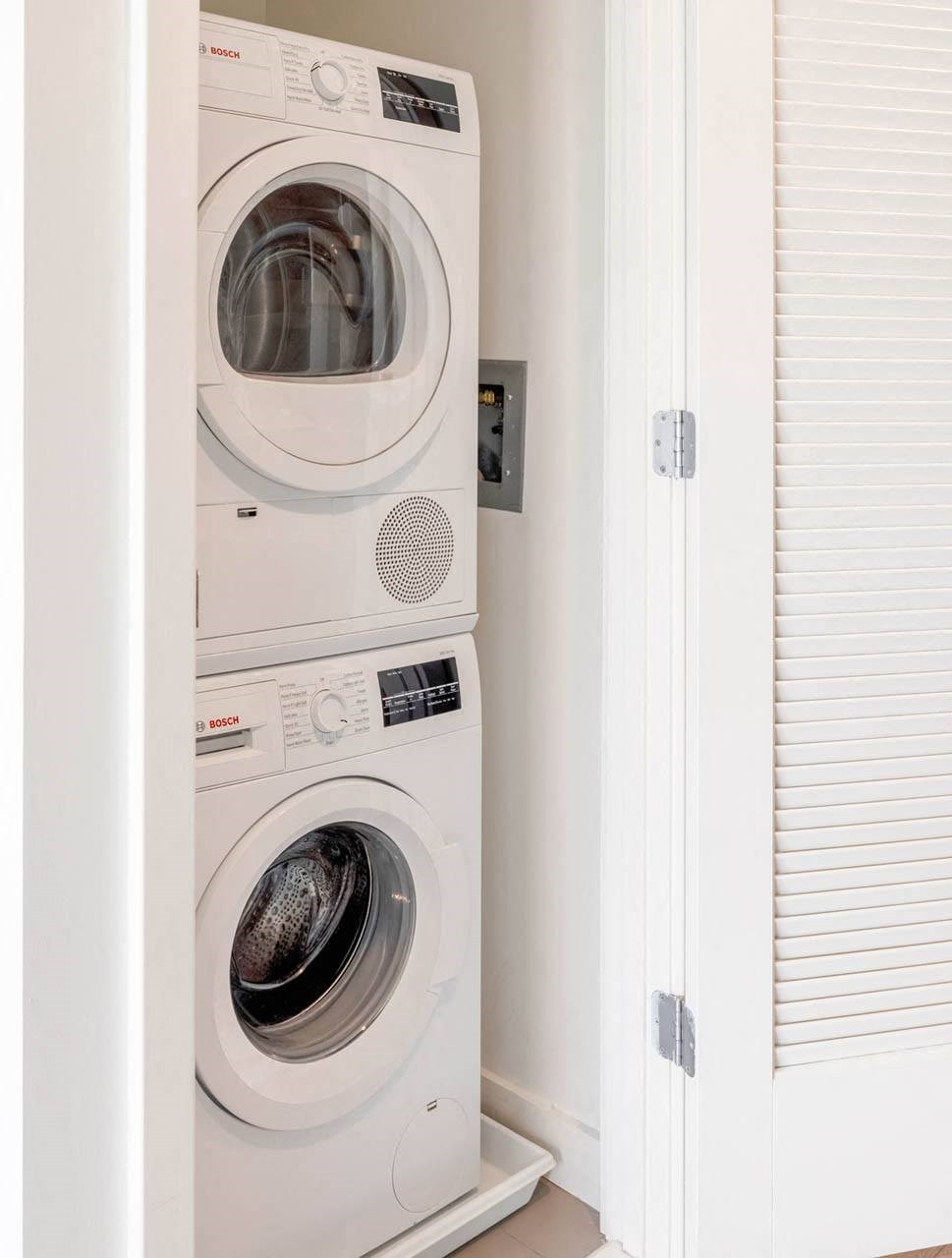 a small laundry room with a washer and dryer