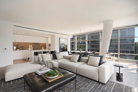 a living room with a white couch and a coffee table