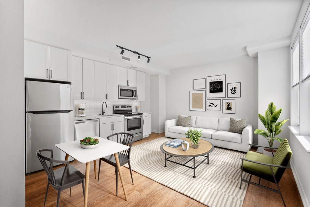 a living room with a white couch and a table