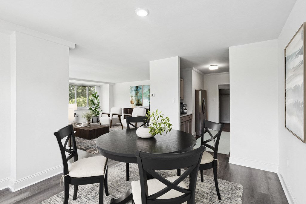 a dining room with a table and chairs