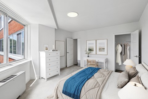 a bedroom with a bed and a dresser