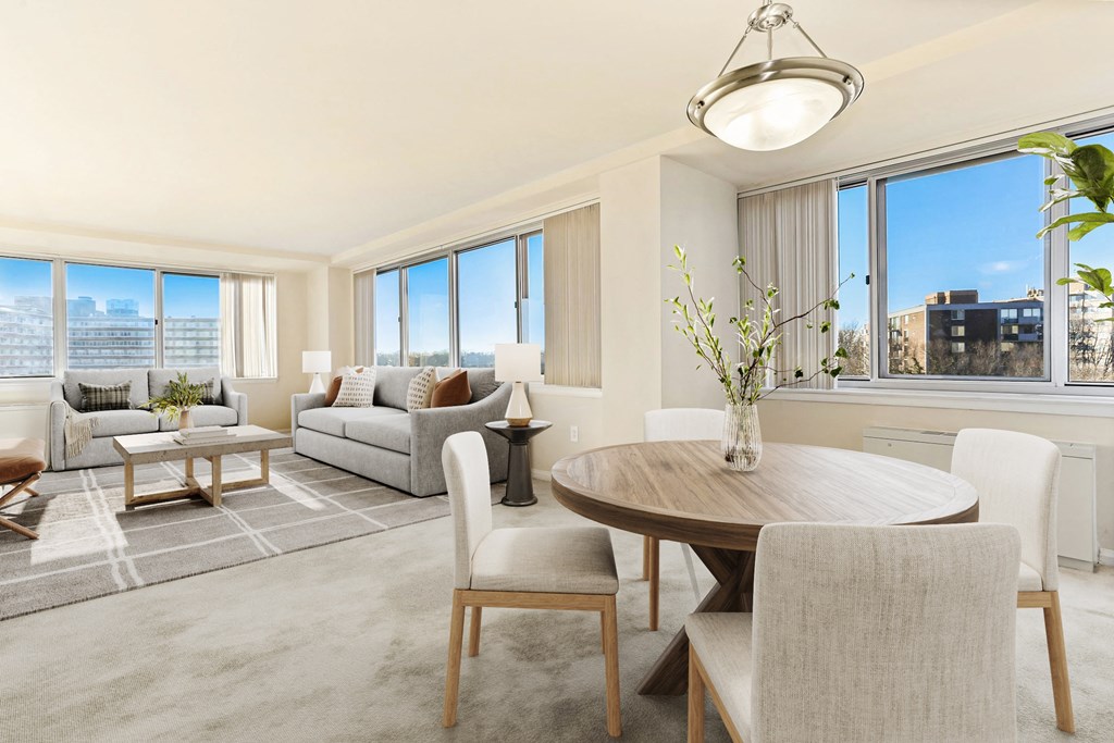 a living room with a dining room table and a couch