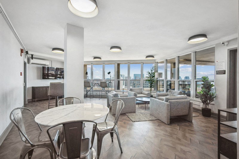 a living room with couches and chairs and a table