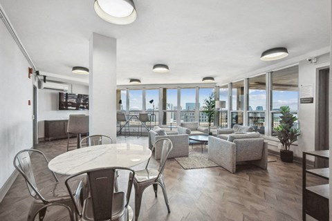 a living room with couches and chairs and a table