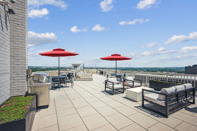 the rooftop terrace at the clarion hotel with umbrellas
