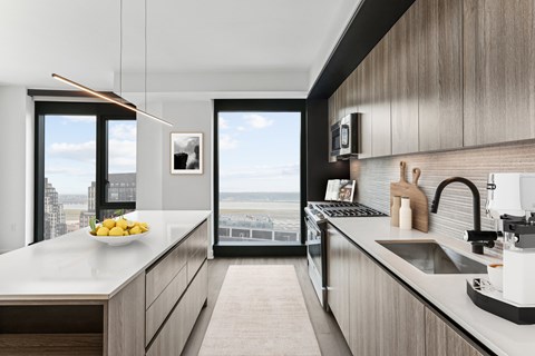 A modern kitchen with a view of the city.
