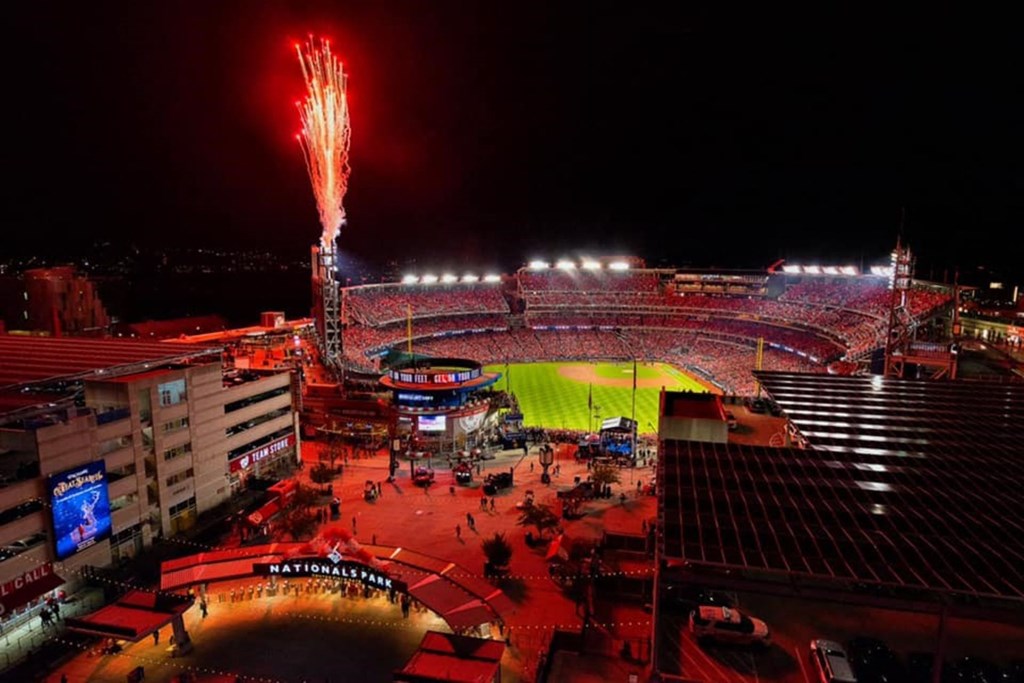 an aerial view of a stadium at night with fireworks