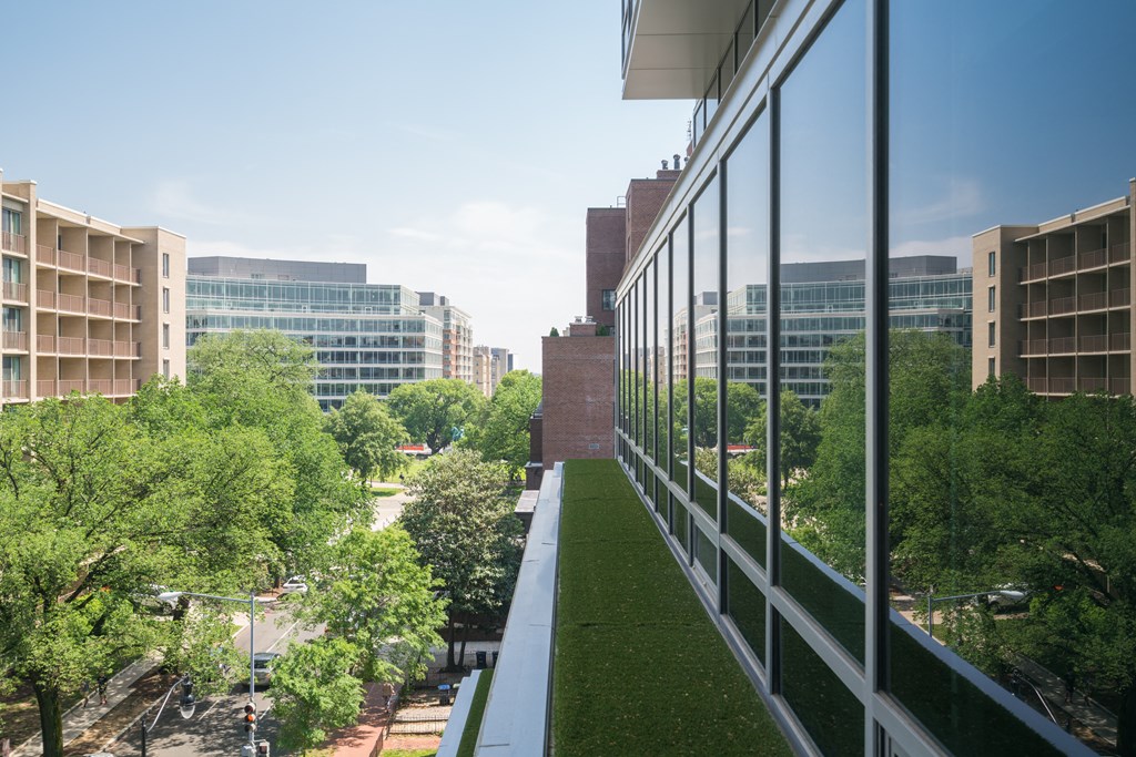 a view of the city from the balcony of a building