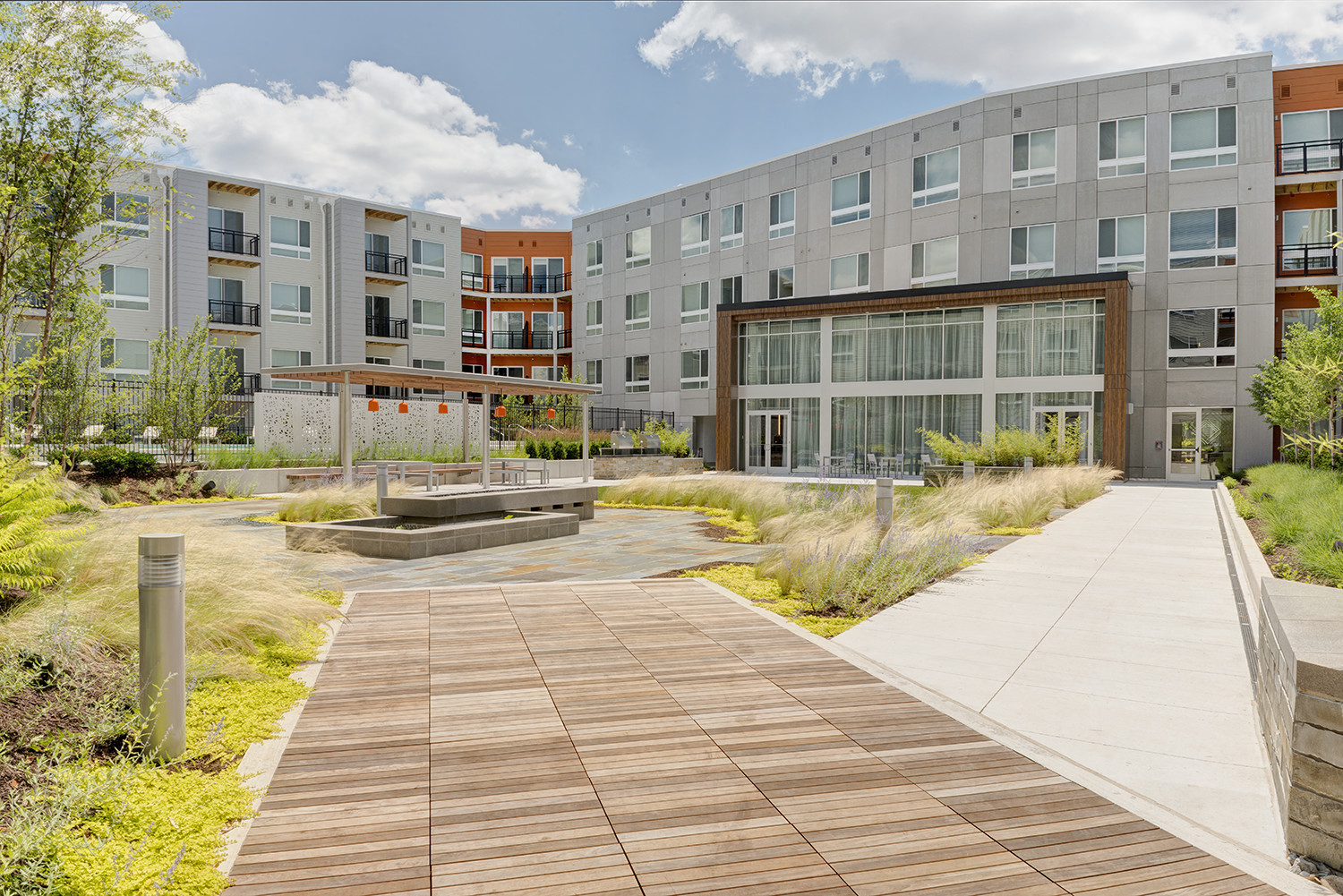 a city square with buildings and a wooden walkway