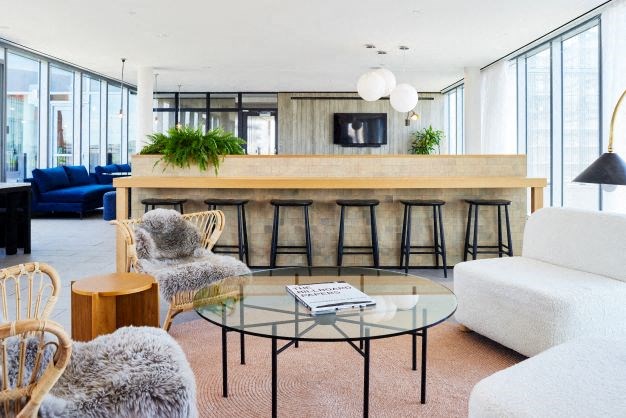 a living room with a bar and a couch