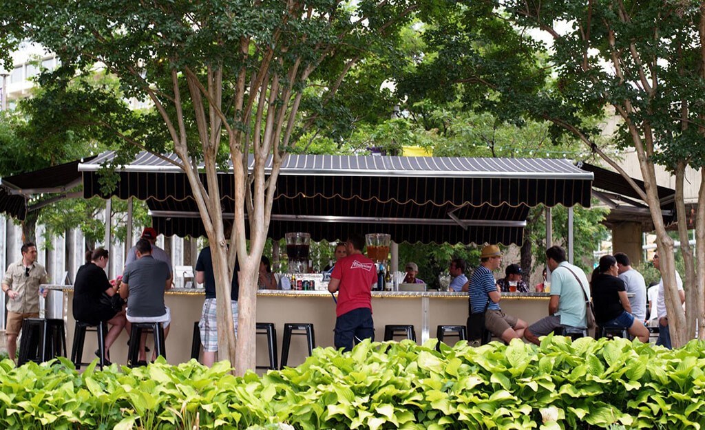 a group of people sitting at a bar