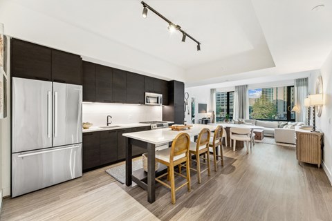 a kitchen and dining room with a table and chairs