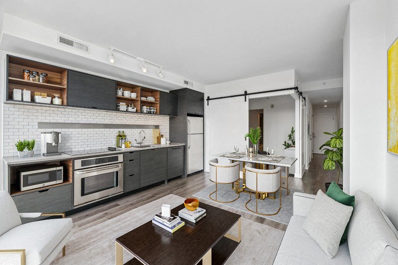 a living room with a kitchen and a dining room