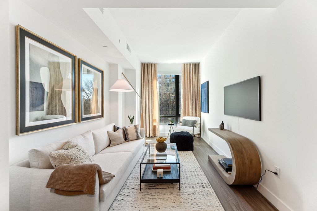 a living room with a white couch and a coffee table