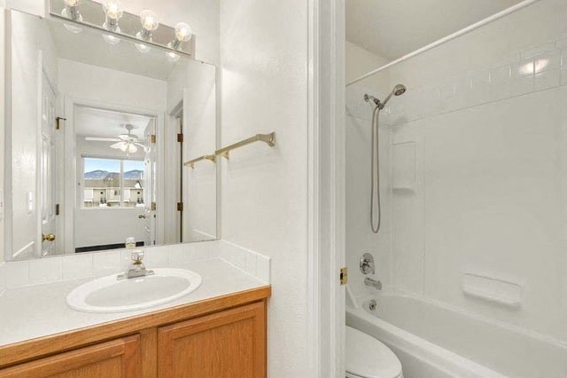 a bathroom with a sink and a shower and a mirror