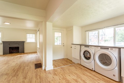 A laundry room with a washer and dryer in it.